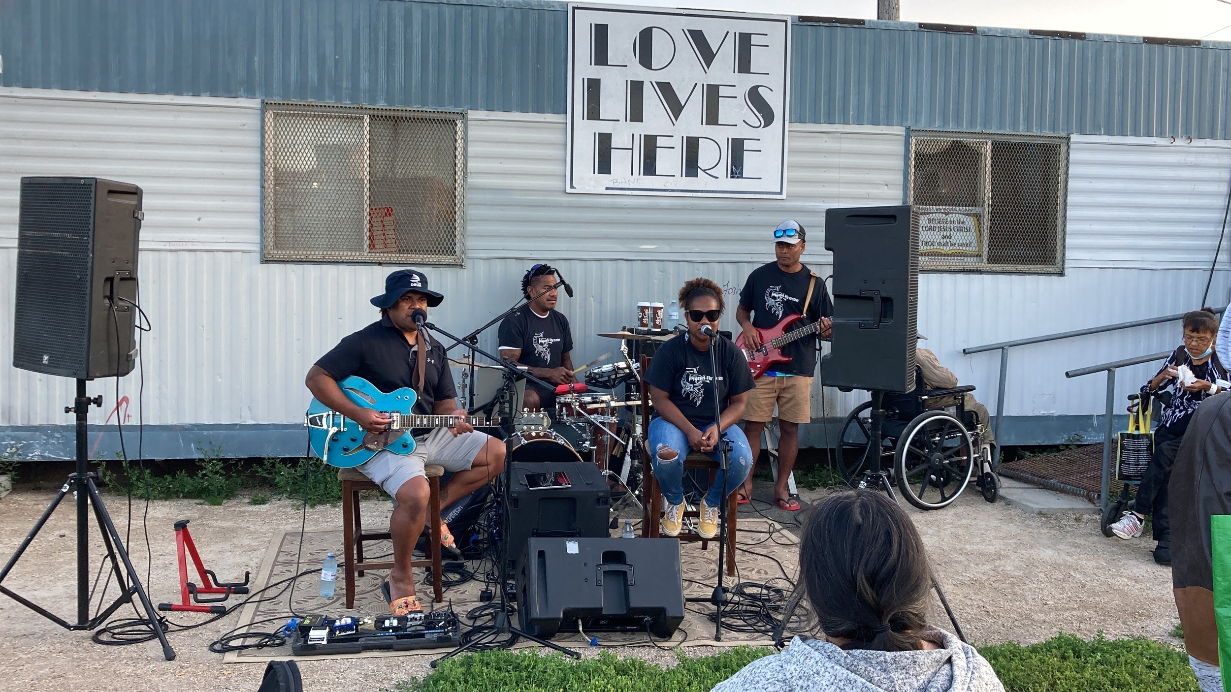Musicians performing outside the Love Lives Here trailer
